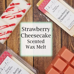 May include: Three wax melts in different packaging. The wax melts are all scented with strawberry cheesecake. The wax melts are in a clear plastic container, a white container with red swirls, and a white container with red text.
