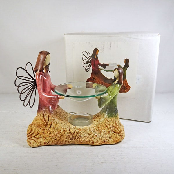 Angel and Child Emerging from the Earth Candle Scented Oil Warmer. One Unscented Candle Included