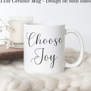May include: White ceramic mug with black text that reads "Choose Joy".