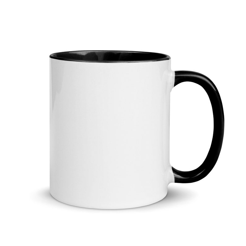 May include: A white ceramic mug with a black rim and handle. The mug is blank and ready for personalization.