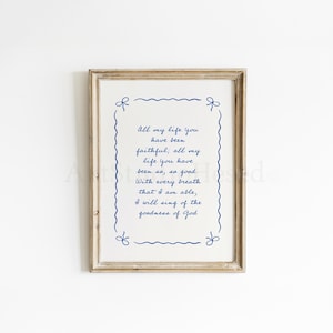 May include: A framed print with a white background and blue text. The text reads "All my life you have been faithful; all my life you have been so, so good. With every breath that I am able, I will sing of the goodness of God."