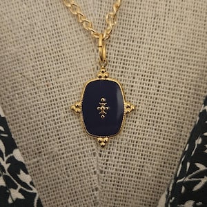 Gold necklace, blue charm pendant