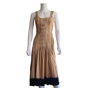 Prada S/S 2004 runway caramel dress with fitted waist and full skirt, inside-out seams, pleats and black tie-dye hem – 2000s fashion