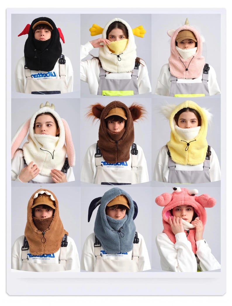 K&ouml;nnte beinhalten: Eine Kollektion von neun Balaclava-Kapuzen aus Pl&uuml;schfleece mit verschiedenen tierinspirierten Designs, darunter ein schwarzer Teufel, eine gelbe Ente, ein rosa Einhorn, ein wei&szlig;er Hase, ein brauner B&auml;r, ein gelbes K&uuml;ken, ein braunes Monster, ein blauer Hund und eine rosa Krabbe.