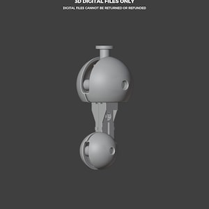 May include: A 3D rendering of a gray, spherical object with a cylindrical top and a lower sphere, connected by a rectangular support. The text "THIS IS NOT A TOY" and "3D DIGITAL FILES ONLY" are visible.