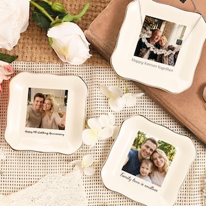 May include: Three white ceramic trinket dishes with gold trim, each displaying a photograph. One dish has a necklace attached. Text on the dishes reads "Happy forever together," "Happy 5th Wedding Anniversary," and "Family love is endless."