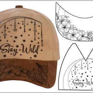 May include: Tan baseball cap with a brown brim. The cap features a black design with the words "Stay Wild" and star and floral accents. Additional black and white floral and fairy designs are included.