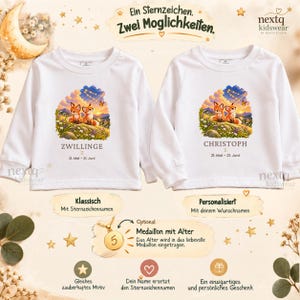 Pode incluir: Duas camisolas brancas de manga comprida com um gr&aacute;fico de duas raposas num campo sob um c&eacute;u estrelado. A camisola da esquerda apresenta o texto ZWILLINGE e a da direita o texto CHRISTOPH, ambas com as datas 21. Mai &ndash; 21. Juni.