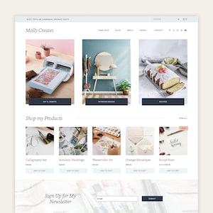 May include: A website homepage for Molly Creates, featuring a variety of products, including calligraphy sets, watercolor sets, and orange envelopes. The website also features a sign-up form for a newsletter.