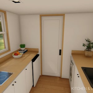 May include: Interior view of a kitchen and laundry area with white cabinets, light wood countertops, and a black sink. A black stovetop and a kettle are visible. The room has a window and a door. The text "KITCHEN & LAUNDRY AREA" is at the bottom.