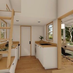 May include: Interior view of a tiny house with a wooden ladder, white cabinets, and a small kitchen area. A window and door frame the view of an outdoor patio. The house has a minimalist design with light wood and white walls.