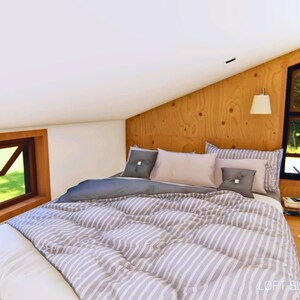loft bedroom with vaulted ceiling that can fit a queen-size bed and storage cabinet