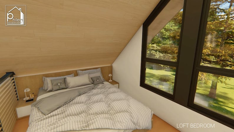 May include: A loft bedroom with a bed, pillows, and a comforter. The room has a sloped ceiling and a large window with a view of trees. The walls are white and the ceiling is wood. The bed has a wooden headboard and two small bedside tables.