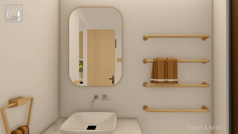 May include: A modern bathroom interior featuring a white sink, a large mirror, and gold-colored towel racks. Brown towels are neatly arranged on one of the racks. The wall is a neutral color, creating a clean and minimalist aesthetic.