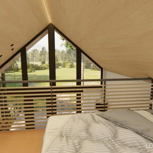 May include: Interior view of a loft bedroom with a bed, pillows, and a window overlooking a green landscape. The room has wooden paneling on the walls and ceiling. A person is standing near the railing. The words "LOFT BEDROOM" are visible.