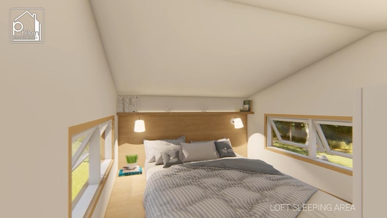 May include: Interior view of a loft bedroom with a bed, pillows, and a gray and white striped comforter. The room has two windows, a wooden headboard, and two hanging lamps. The text "LOFT SLEEPING AREA" is visible.