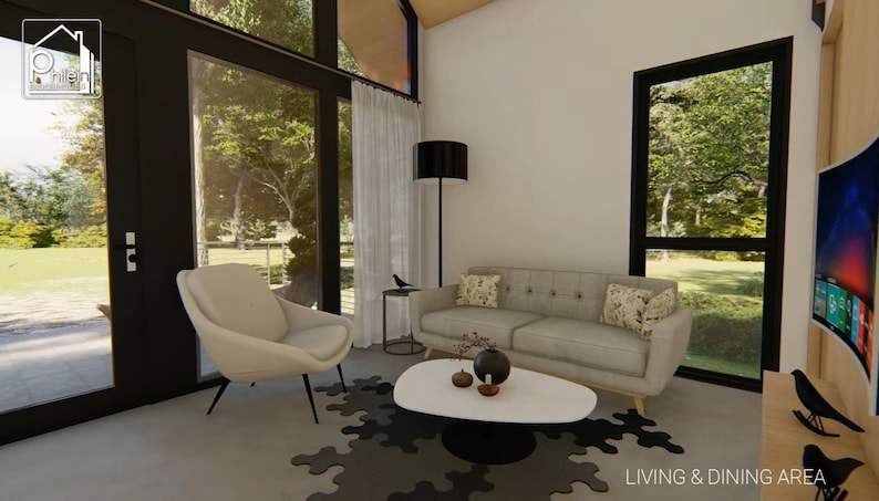 May include: A modern living room with a light gray sofa, a white oval coffee table, and a black floor lamp. A large window offers a view of the outdoors. The room is decorated with neutral colors and a patterned rug.