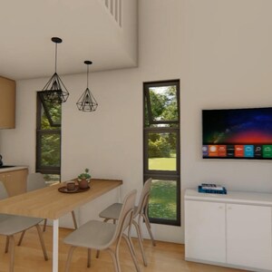 May include: Interior shot of a modern dining area with a wooden table and chairs. Two geometric pendant lights hang above the table. A large flat-screen TV is mounted on the wall. The kitchen features light wood cabinets.