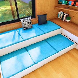 the sofa in the living room is also a pull-out bed for guests