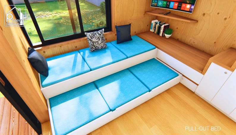 the sofa in the living room is also a pull-out bed for guests