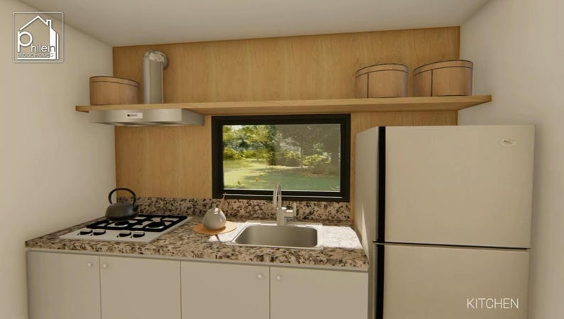 May include: A kitchen interior with light-colored cabinets, a granite countertop, and a stainless steel sink. A gas stove, range hood, and refrigerator are visible. Two decorative containers sit on a shelf above the sink. The word "KITCHEN" is written on the bottom right.
