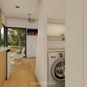 Puede incluir: Vista interior de una cocina y lavander&iacute;a modernas. La cocina cuenta con gabinetes de madera clara, una encimera de m&aacute;rmol y un horno empotrado. La lavander&iacute;a incluye una lavadora. El texto "LAUNDRY AREA" es visible.