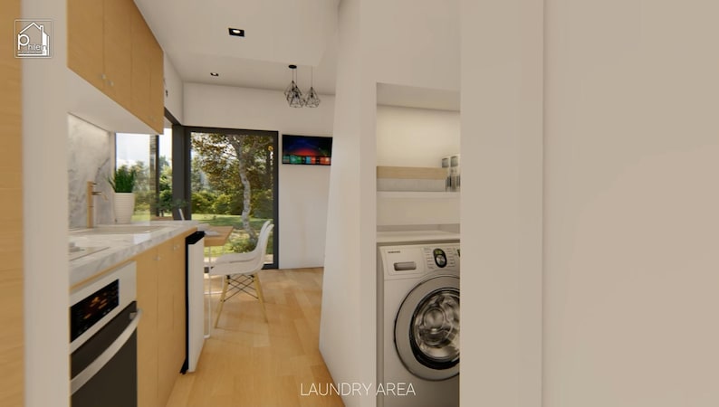 Puede incluir: Vista interior de una cocina y lavander&iacute;a modernas. La cocina cuenta con gabinetes de madera clara, una encimera de m&aacute;rmol y un horno empotrado. La lavander&iacute;a incluye una lavadora. El texto "LAUNDRY AREA" es visible.