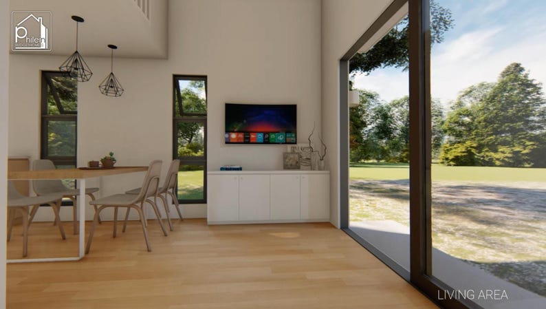 May include: Interior view of a modern living area with a dining table and chairs, a wall-mounted television, and a large window overlooking a green landscape. The room features light-colored wood flooring and white walls.