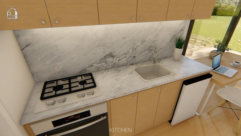 Puede incluir: Una cocina moderna con gabinetes de madera clara, una encimera de m&aacute;rmol y electrodom&eacute;sticos de acero inoxidable. Incluye una estufa de gas, un fregadero y un peque&ntilde;o refrigerador. Una computadora port&aacute;til y una taza de caf&eacute; est&aacute;n en una mesa cercana.