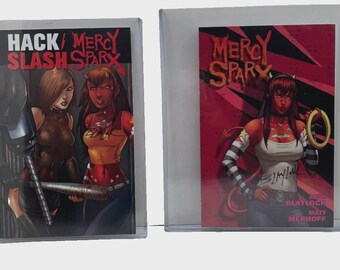 May include: Two comic books in clear protective sleeves. The left cover features the text HACK/SLASH MERCY SPARX with two female characters. The right cover features the text MERCY SPARX with a red-skinned character holding a gold ring and signatures.