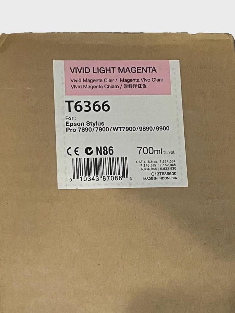 May include: A brown cardboard box with a label for Vivid Light Magenta ink. The label includes the product code T6366, the Epson Stylus model, and a 700ml fill volume. The label also has a barcode and the text "MADE IN INDONESIA".