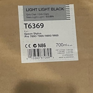 May include: A rectangular box with a label that reads "LIGHT LIGHT BLACK." The label includes the text "T6369" and "Epson Stylus Pro 7890/7900/9890/9900." It also indicates a volume of 700ml and is made in Indonesia.