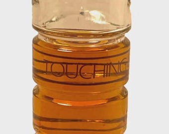 A. Vintage Bottle Of Flori Roberts Touching Cologne Splash