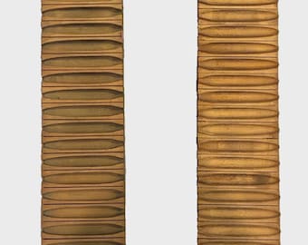May include: Two rectangular wooden boards featuring a series of horizontal, carved grooves along their length. Each board includes a small, black, cup-shaped metal candle holder attached near the bottom and a circular hole at the top for hanging.