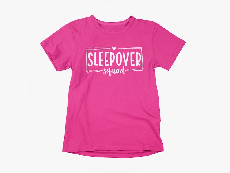 May include: Pink t-shirt with white text that says "Sleepover Squad" with a small heart above the word "Sleepover".