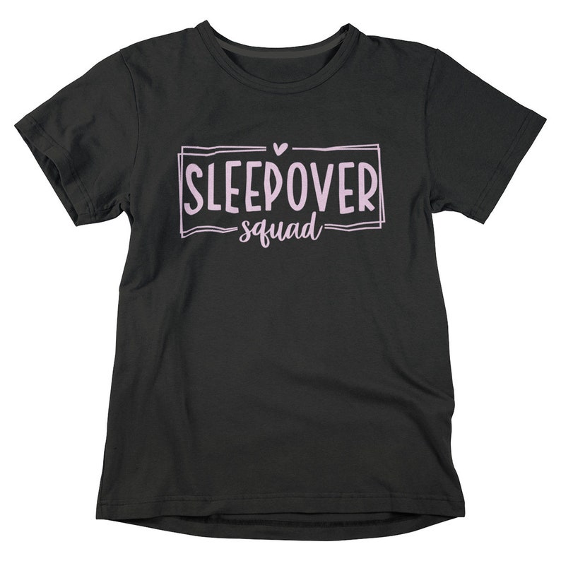 May include: Black t-shirt with a pink graphic that says "Sleepover squad" with a small pink heart above the text.