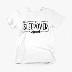May include: White t-shirt with black text that says "Sleepover Squad" with a small heart above the word "Sleepover".