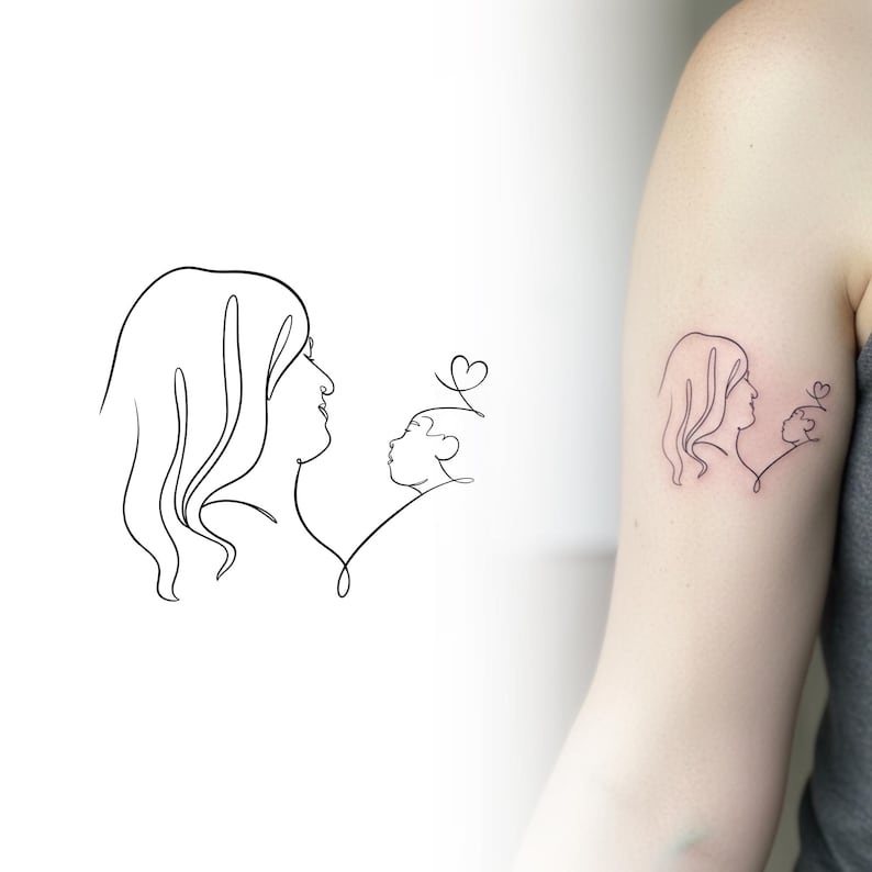 Minimalist single line tattoo of a mother and child on a woman's arm