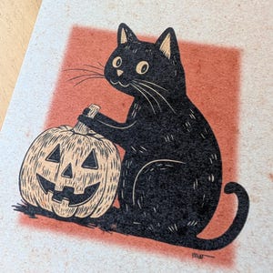 May include: A black cat illustration with a carved pumpkin. The cat is sitting next to the pumpkin, which has a smiling face. The background is a red square on a beige paper.