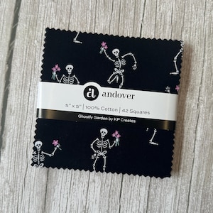 May include: A stack of black fabric squares, each 12.7cm x 12.7cm, featuring a pattern of white skeletons with pink flowers. The fabric is 100% cotton and is labelled "Ghostly Garden by KP Creates."