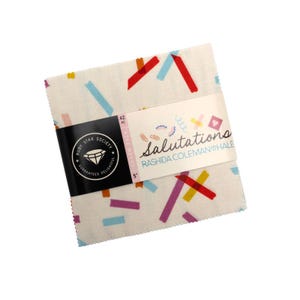 May include: A bundle of fabric squares, each 12.7 cm, featuring a confetti design in red, blue, yellow, and purple. The fabric is wrapped with a label that reads "Salutations" by Rashida Coleman-Hale, and includes the Ruby Star Society logo.