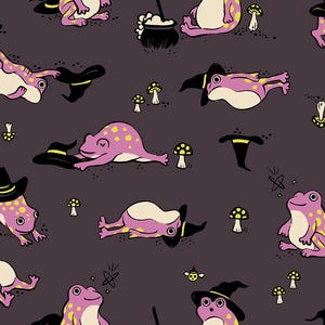 May include: A repeating pattern on a dark grey background featuring pink frogs with yellow spots. Some frogs wear black pointed hats, while others are depicted near small white mushrooms, black cauldrons, and black broomsticks with white bristles.