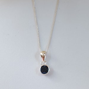 Birthstone December Silver 4mm CZ Swiss Blue Pendant with an 18&quot; Curb Chain