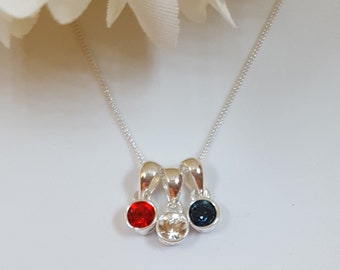 Silver and CZ family birthstone pendant. Add more birthstones.