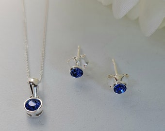 Birthstone September Bright Blue CZ Pendant and 3.5mm Stud Earrrings set. Pendant is on an 18inch Curb Chain.