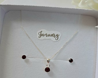 Birthstone January Sterling Silver and 4mm  Dark Red CZ stone Pendant and 3.5mm Stud Earrings Set. Pendant is on a 16 to 18inch Curb Chain