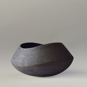 Contemporary artistic ceramic centerpiece, black clay object for modern brutalist art decoration, modern minimalist geometric sculpture