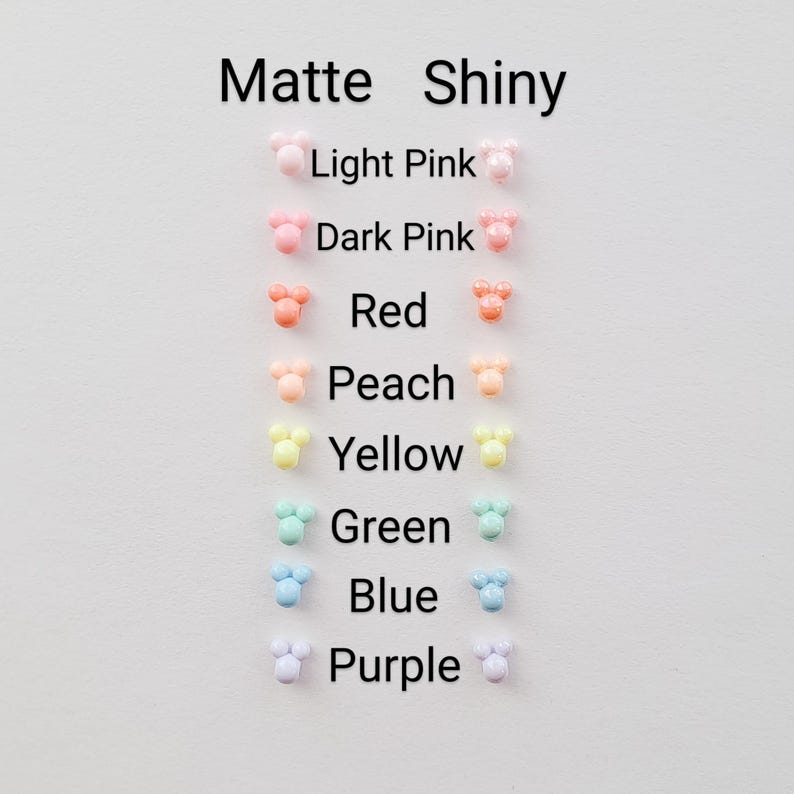May include: A chart showing the color options for matte and shiny Mickey Mouse ears. The colors are light pink, dark pink, red, peach, yellow, green, blue, and purple.