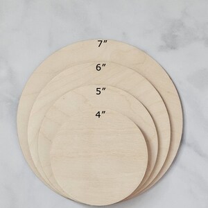 May include: Four unfinished wooden circles, nested inside each other, with diameters of 4 inches, 5 inches, 6 inches, and 7 inches.