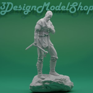May include: A white 3D printed figurine of a warrior holding an axe. The figurine is standing on a rock base. The background is a solid green.